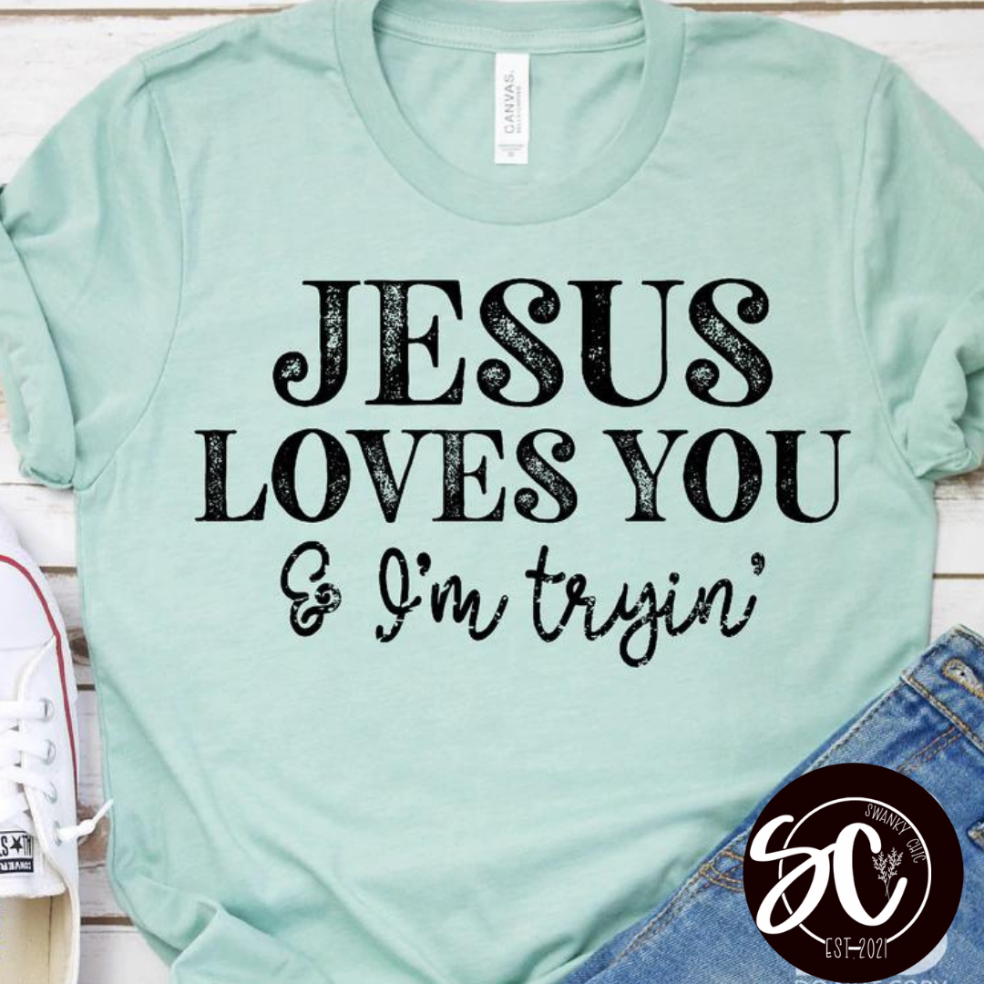 Serena Brown — Jesus loves you and I’m tryin’: Small, Heather prism dusty blue, crewneck tee