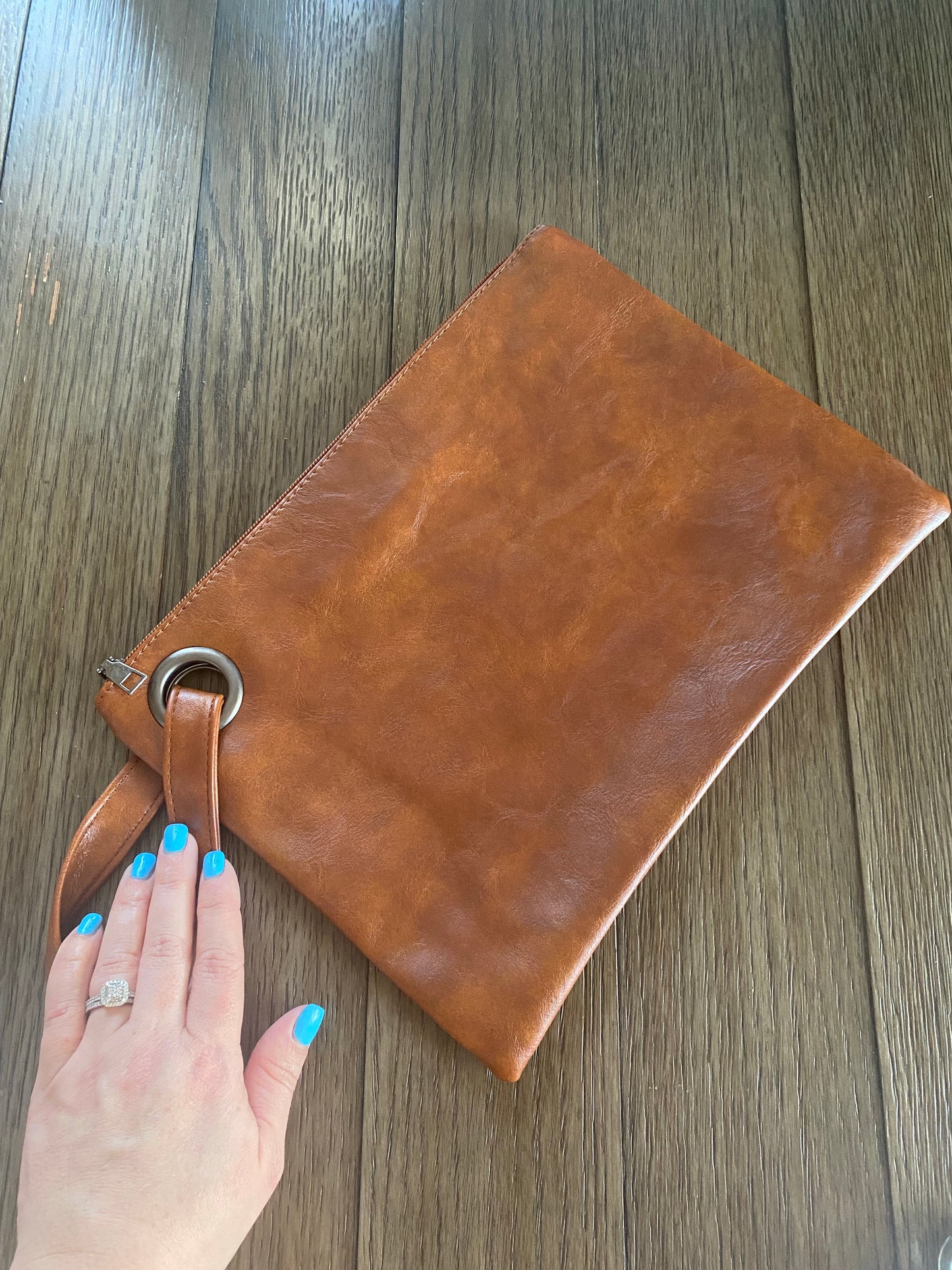 Annie Petitt — cognac wrist handbag