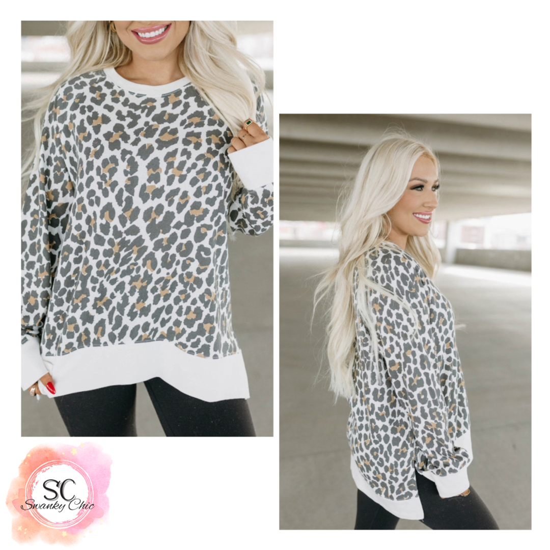 Courtney Byrd — Large, white leopard pullover