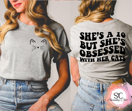 Ashley Harris Vanderpool — She’s a 10 but obsessed with her cats (front + back): XL, neon pink,v-neck tee